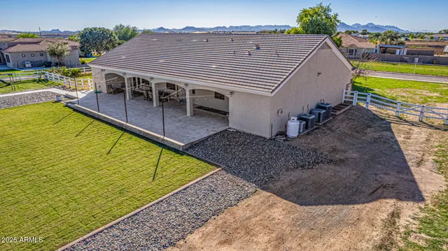 a front view of a house with a garden and plants