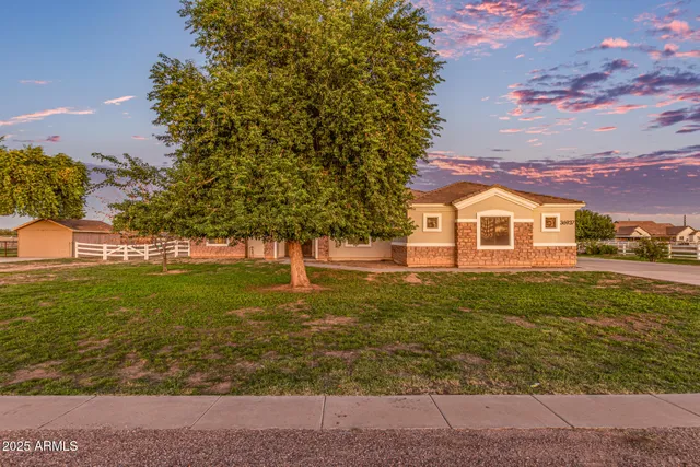 a view of a dining room with a table and chairs