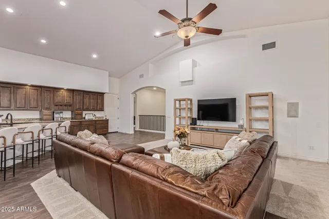 a spacious bedroom with a bed and a table