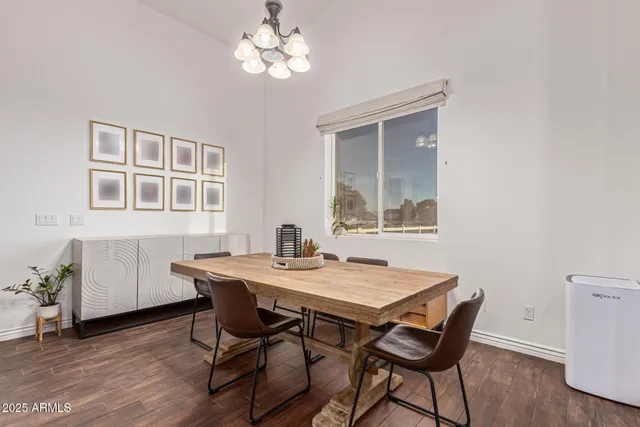 a view of a livingroom with a ceiling fan and window