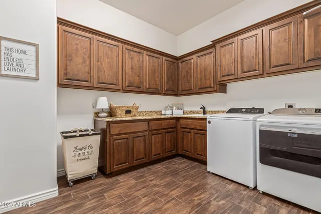 a view of a living room with a table and chairs