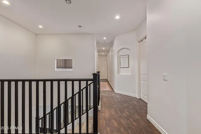 a view of a patio with table and chairs and potted plants
