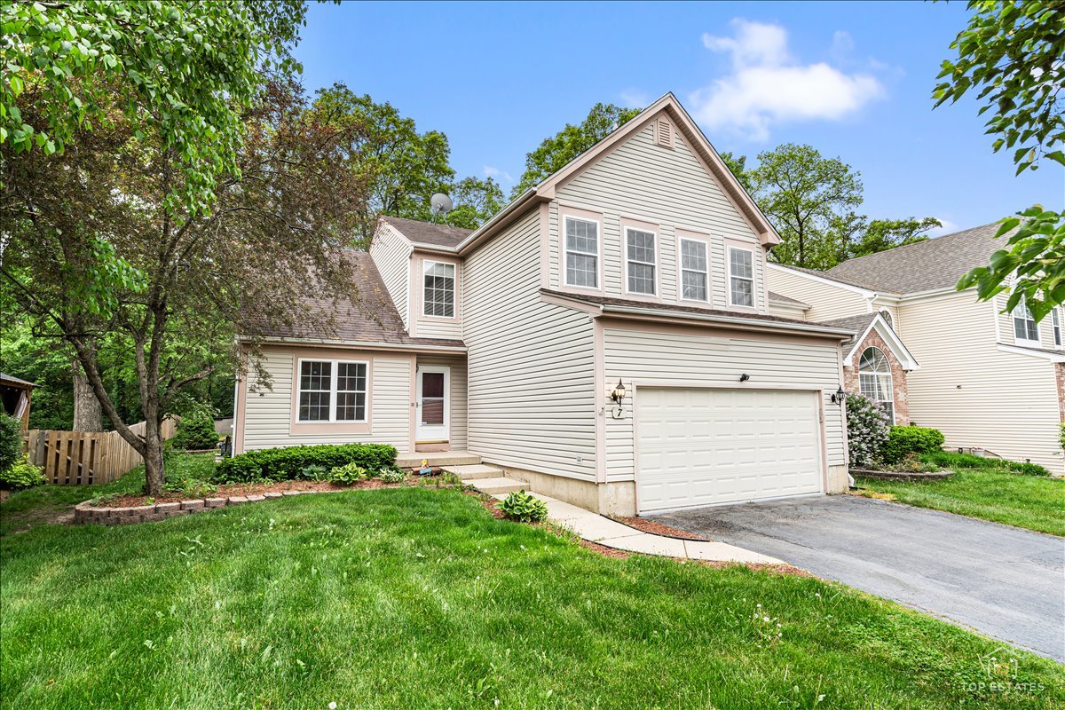 7 Eagle Court Streamwood, IL 60107 - Photo 1 of 31 a front view of house with yard and green space