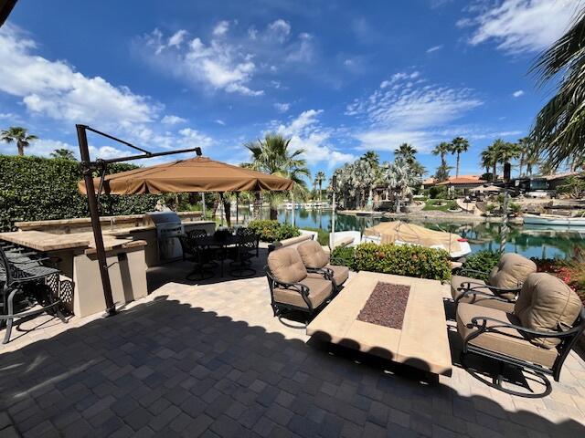 80501 Ave 48, Unit 214 Indio, CA 92201 - Photo 16 of 21 a view of a patio with swimming pool