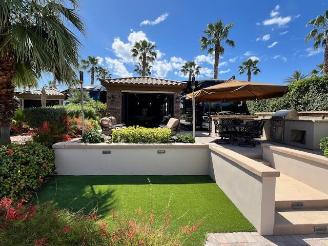 80501 Ave 48, Unit 214 Indio, CA 92201 - Photo 19 of 21 a view of a swimming pool with a patio