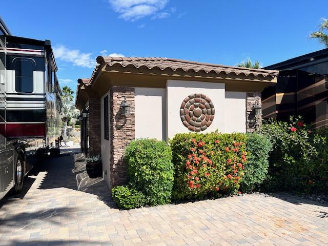 80501 Ave 48, Unit 214 Indio, CA 92201 - Photo 2 of 21 a view of a pathway both side of house