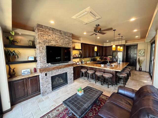 80501 Ave 48, Unit 214 Indio, CA 92201 - Photo 6 of 21 a living room with fireplace furniture and a flat screen tv