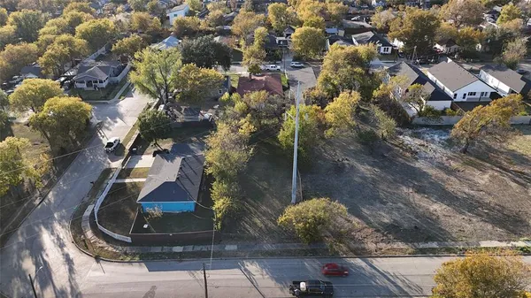 a aerial view of a house with a yard