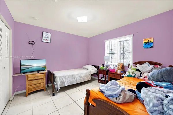 a bedroom with furniture and a window