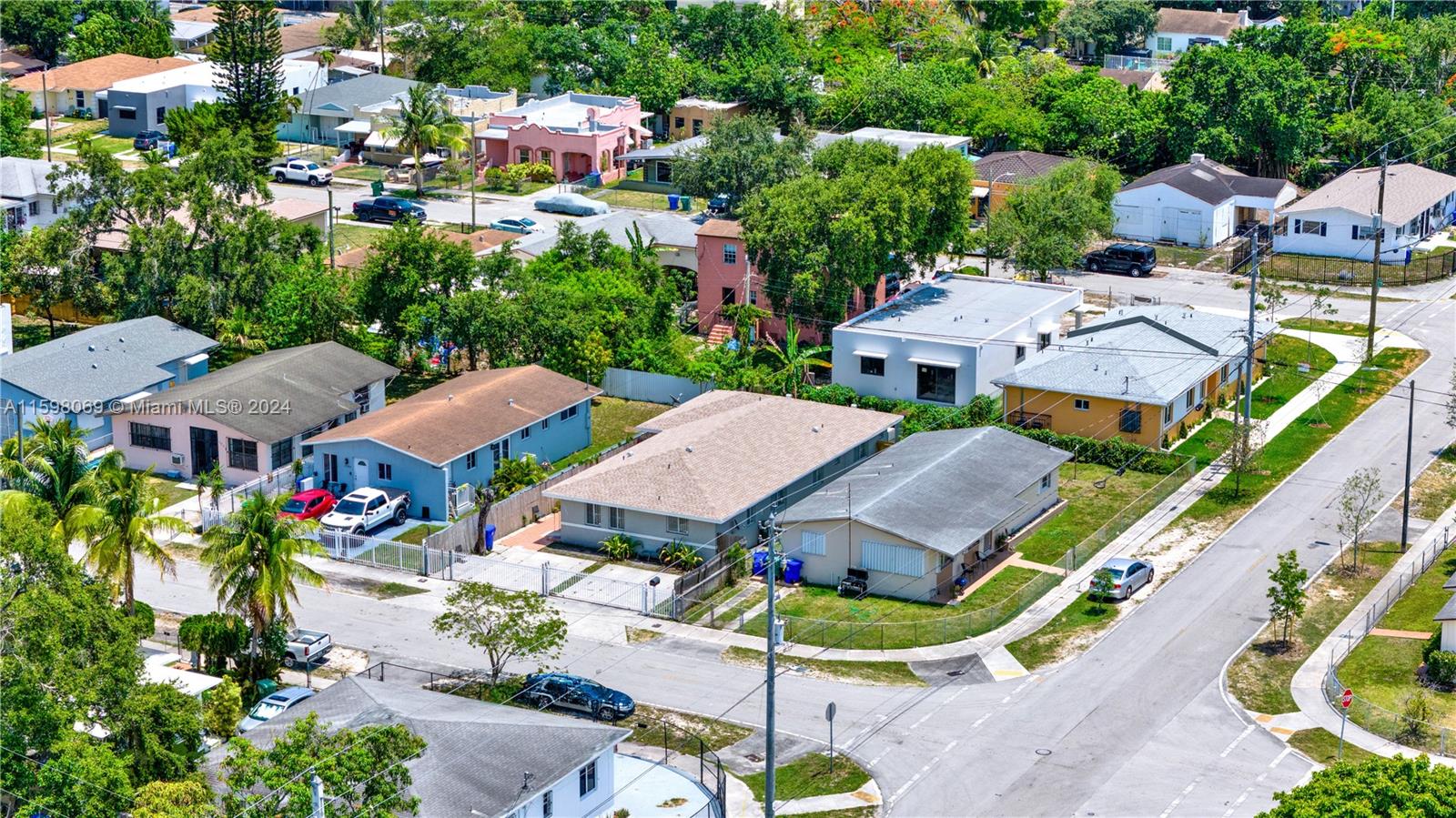1786 Northwest 47th Terrace Miami, FL 33142 - Photo 25 of 25 an aerial view of multiple houses with yard