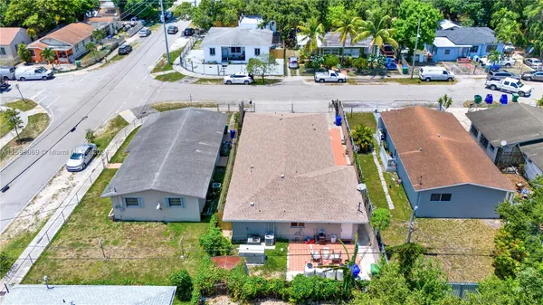 an aerial view of a house with outdoor space