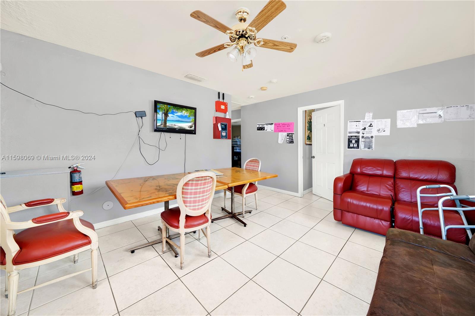 1786 Northwest 47th Terrace Miami, FL 33142 - Photo 10 of 25 a living room with furniture a rug and a fan
