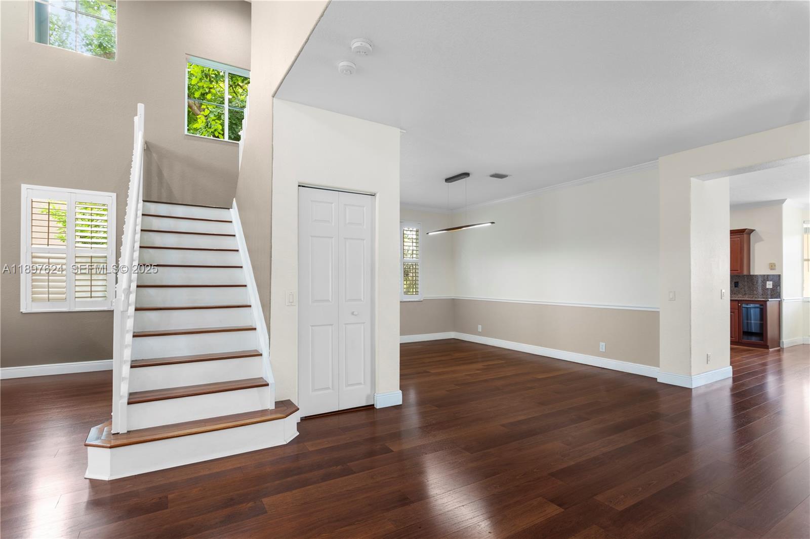 3620 Heron Ridge Lane Weston, FL 33331 - Photo 11 of 37 an empty room with wooden floor and windows