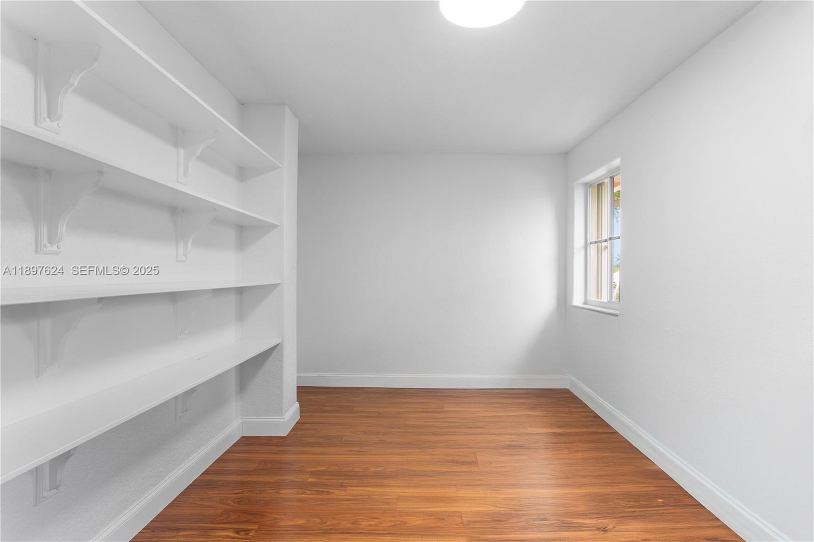 3620 Heron Ridge Lane Weston, FL 33331 - Photo 15 of 37 a view of room with wooden floor