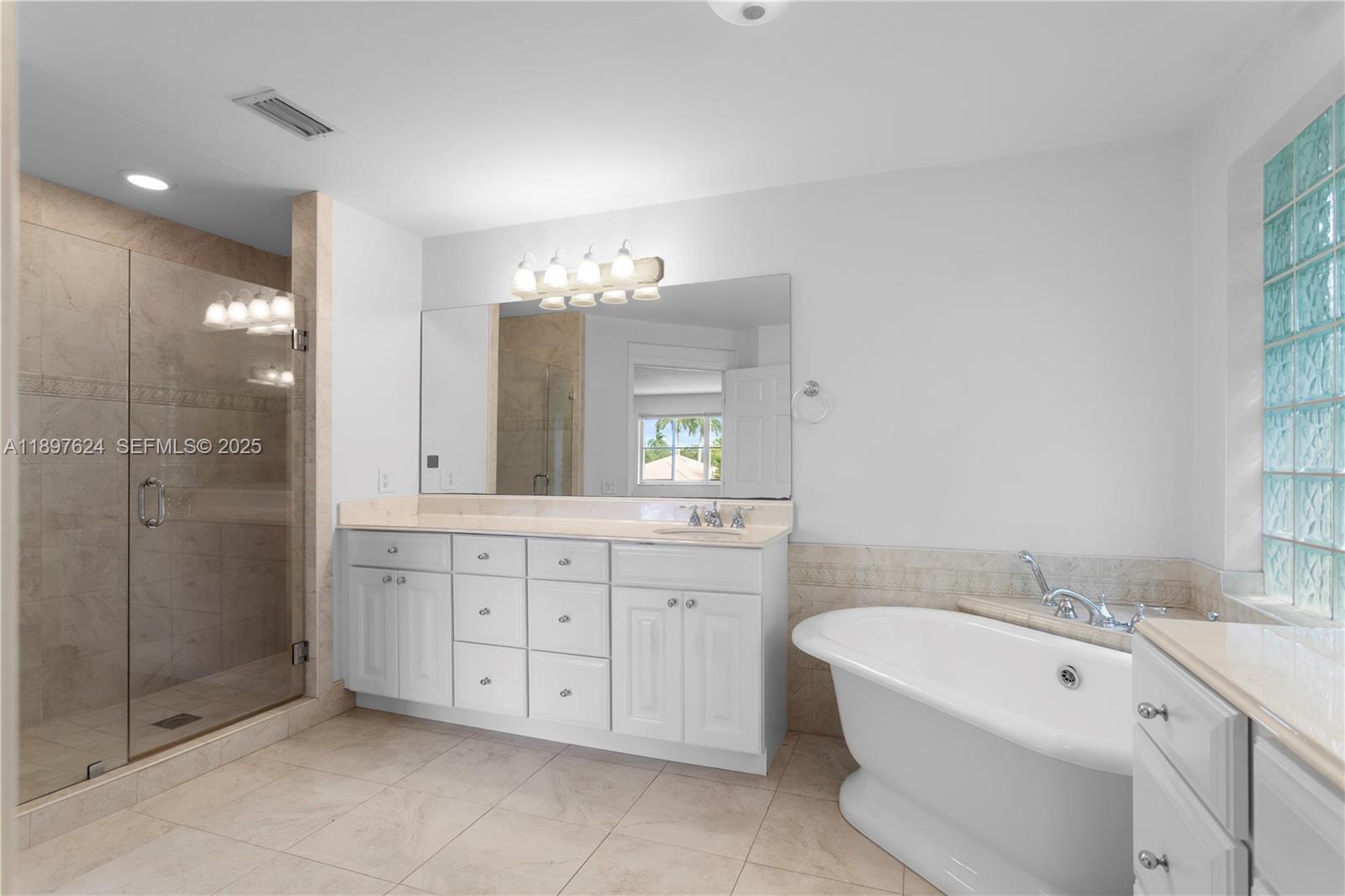 3620 Heron Ridge Lane Weston, FL 33331 - Photo 17 of 37 a spacious bathroom with a double vanity sink mirror and double