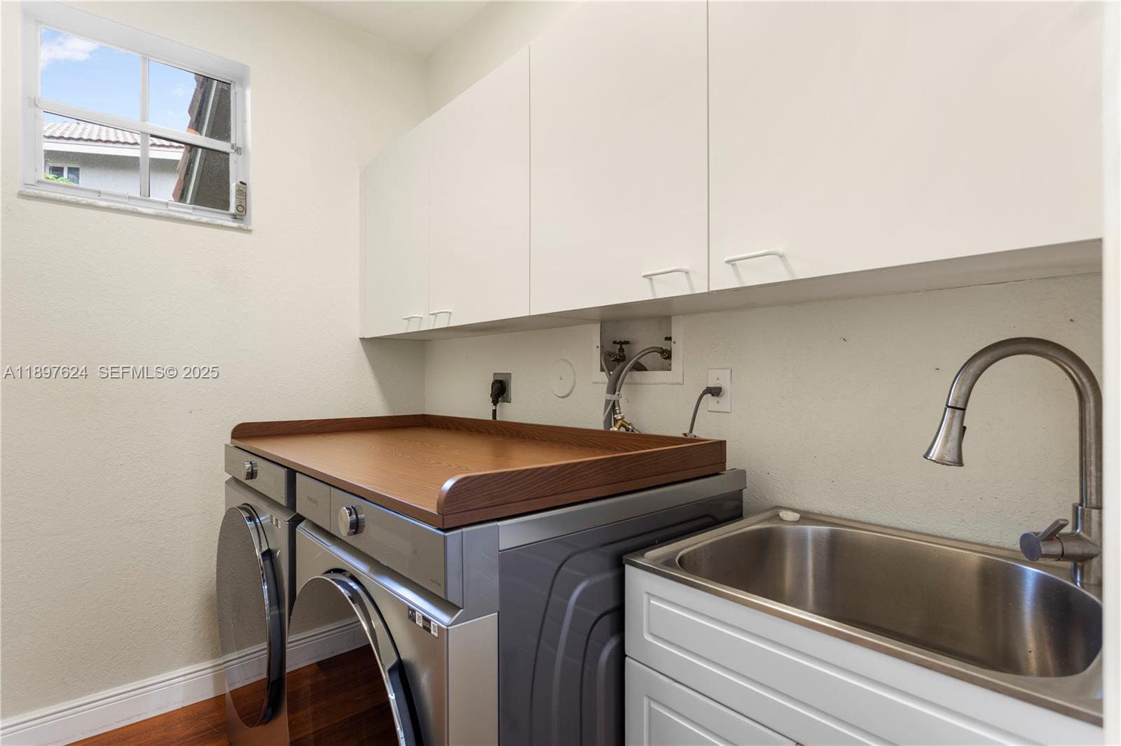 3620 Heron Ridge Lane Weston, FL 33331 - Photo 22 of 37 a kitchen with stainless steel appliances a sink and cabinets