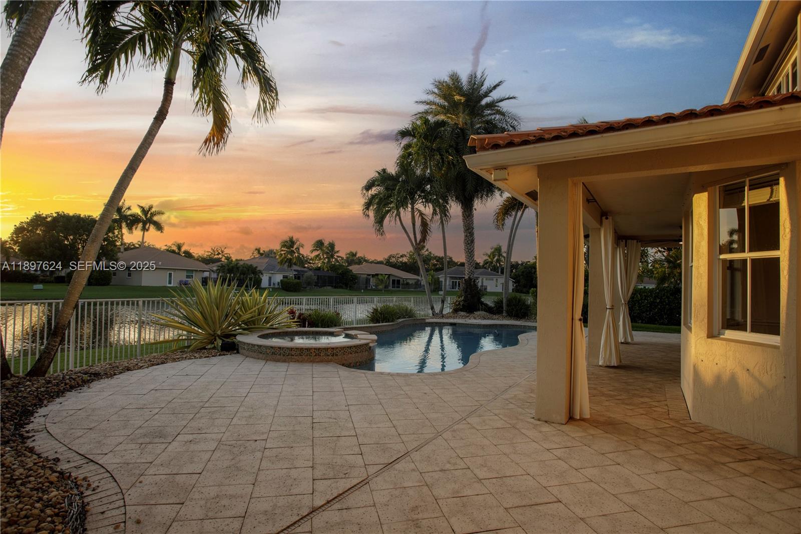 3620 Heron Ridge Lane Weston, FL 33331 - Photo 23 of 37 a view of swimming pool with a table and chairs