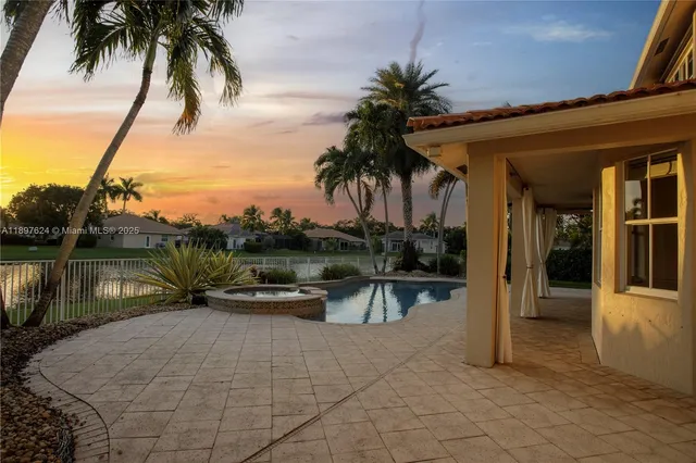 a view of swimming pool with a table and chairs