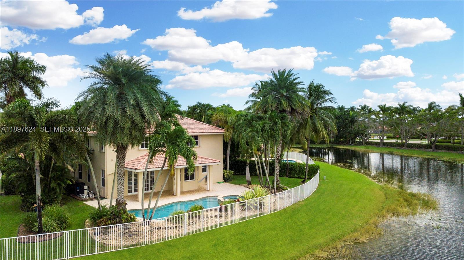 3620 Heron Ridge Lane Weston, FL 33331 - Photo 27 of 37 a view of a house with a yard and potted plants