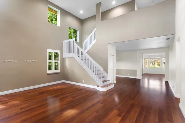 a view of an entryway with wooden floor