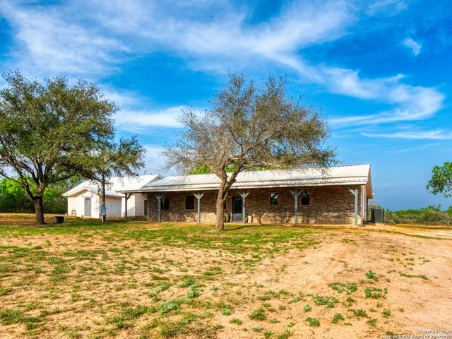 a front view of a house with swimming pool