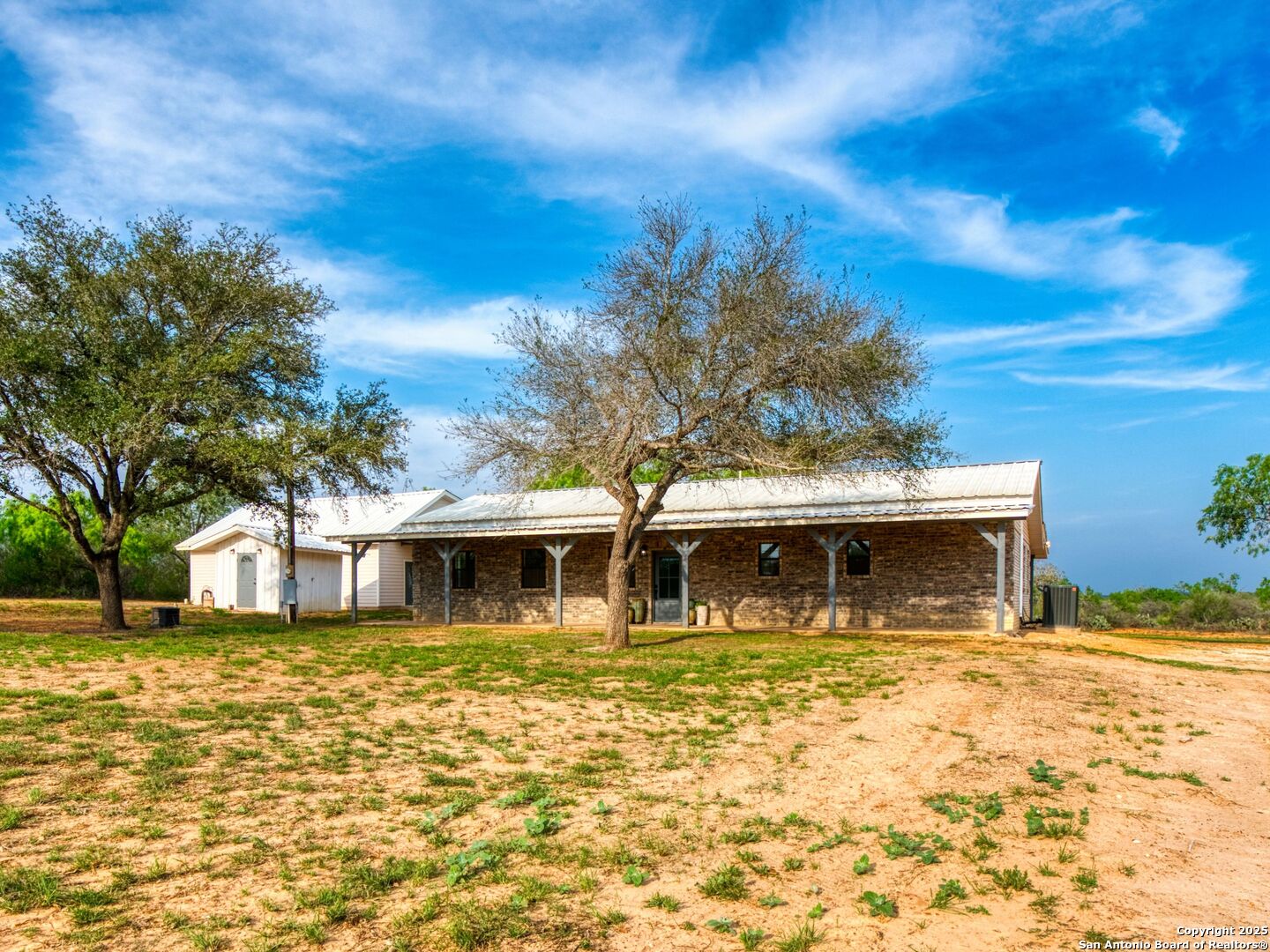 601 Wild Flower Drive Lytle, TX 78052 - Photo 11 of 50 a front view of a house with swimming pool