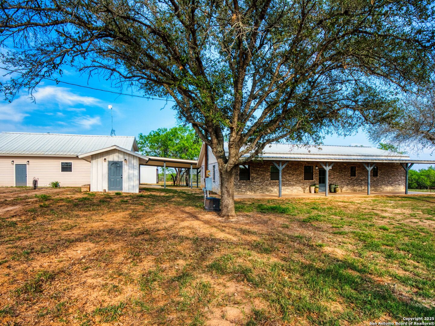 601 Wild Flower Drive Lytle, TX 78052 - Photo 12 of 50 a front view of a house with a garden