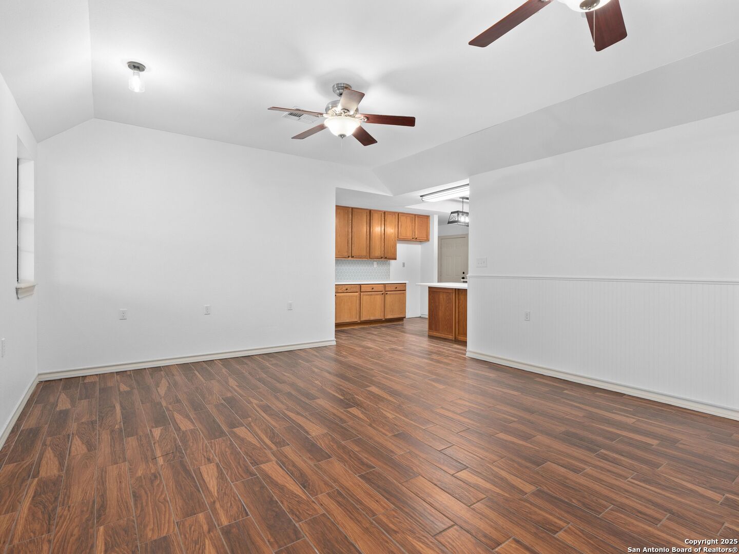 601 Wild Flower Drive Lytle, TX 78052 - Photo 14 of 50 an empty room with wooden floor closet and windows