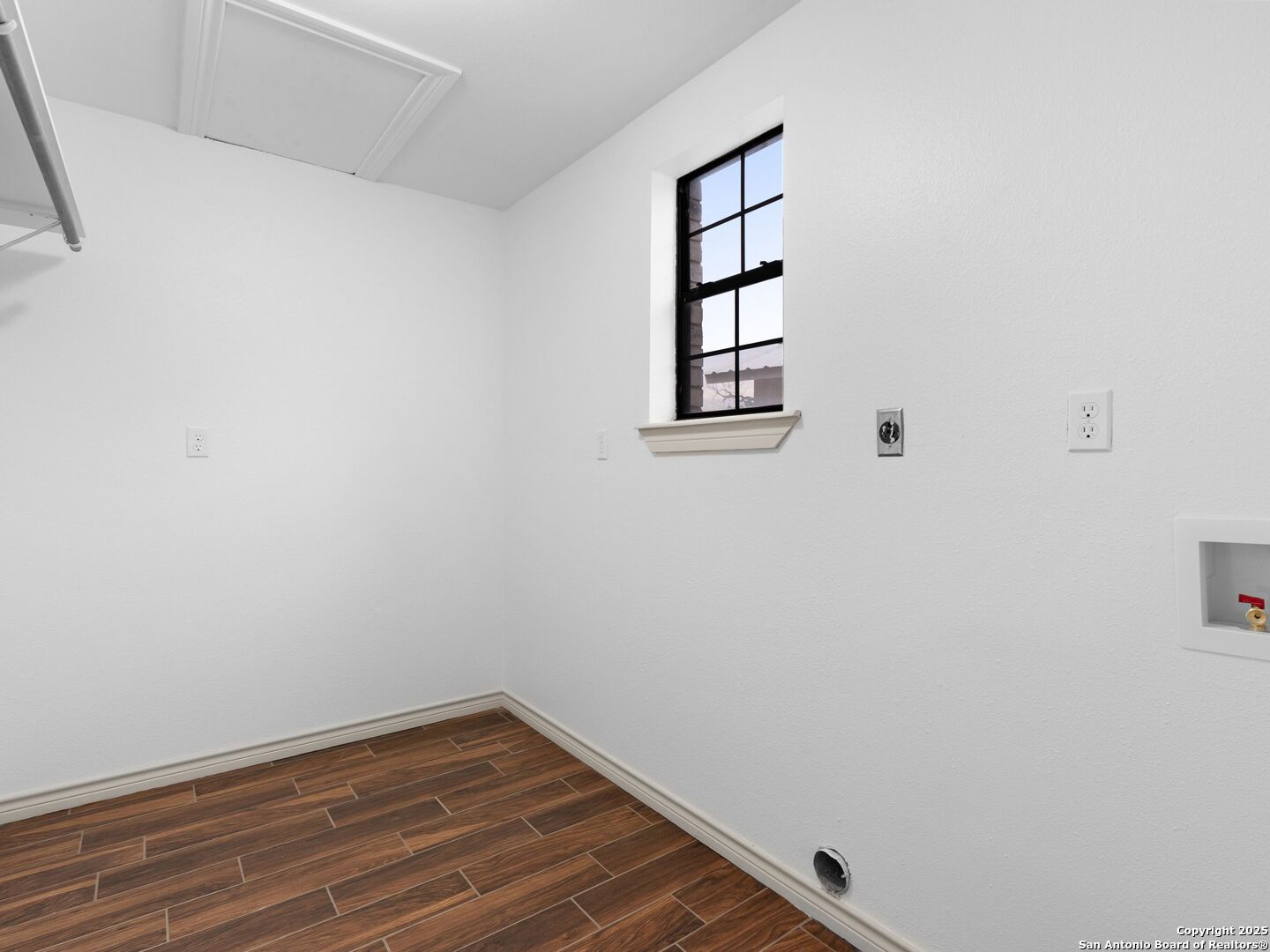 601 Wild Flower Drive Lytle, TX 78052 - Photo 23 of 50 a view of a room with wooden floor and window