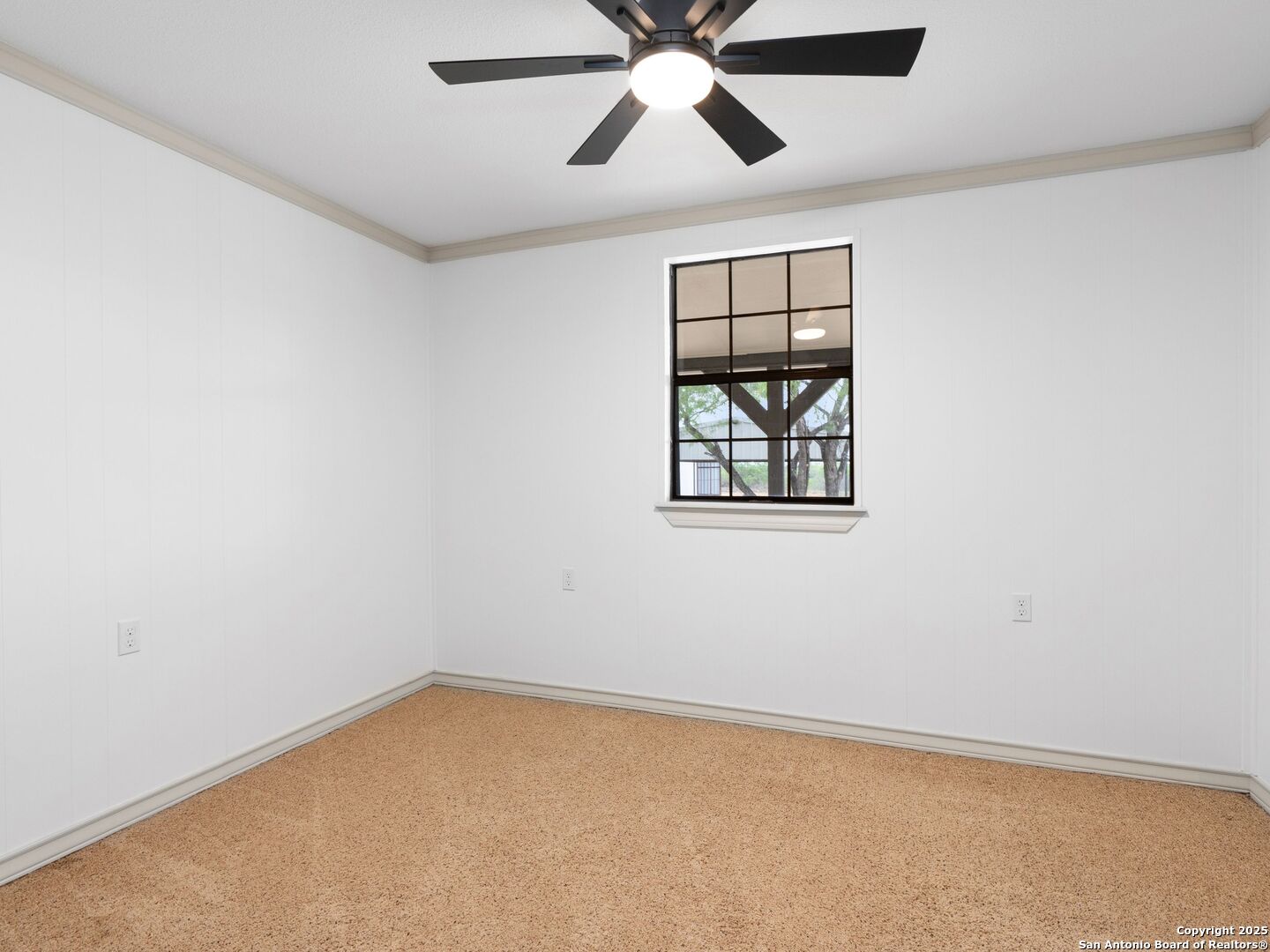 601 Wild Flower Drive Lytle, TX 78052 - Photo 30 of 50 an empty room with windows and fan