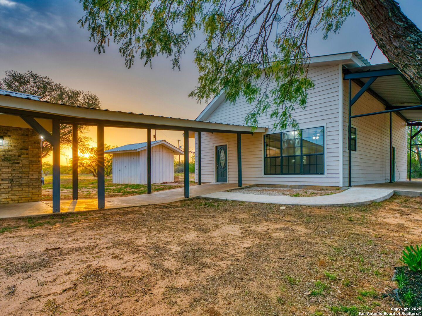 601 Wild Flower Drive Lytle, TX 78052 - Photo 31 of 50 a view of an house with backyard and garden