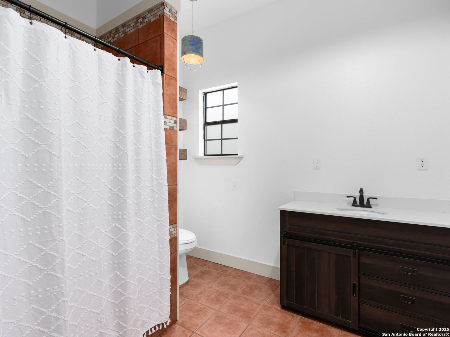601 Wild Flower Drive Lytle, TX 78052 - Photo 41 of 50 a bathroom with a sink and a mirror