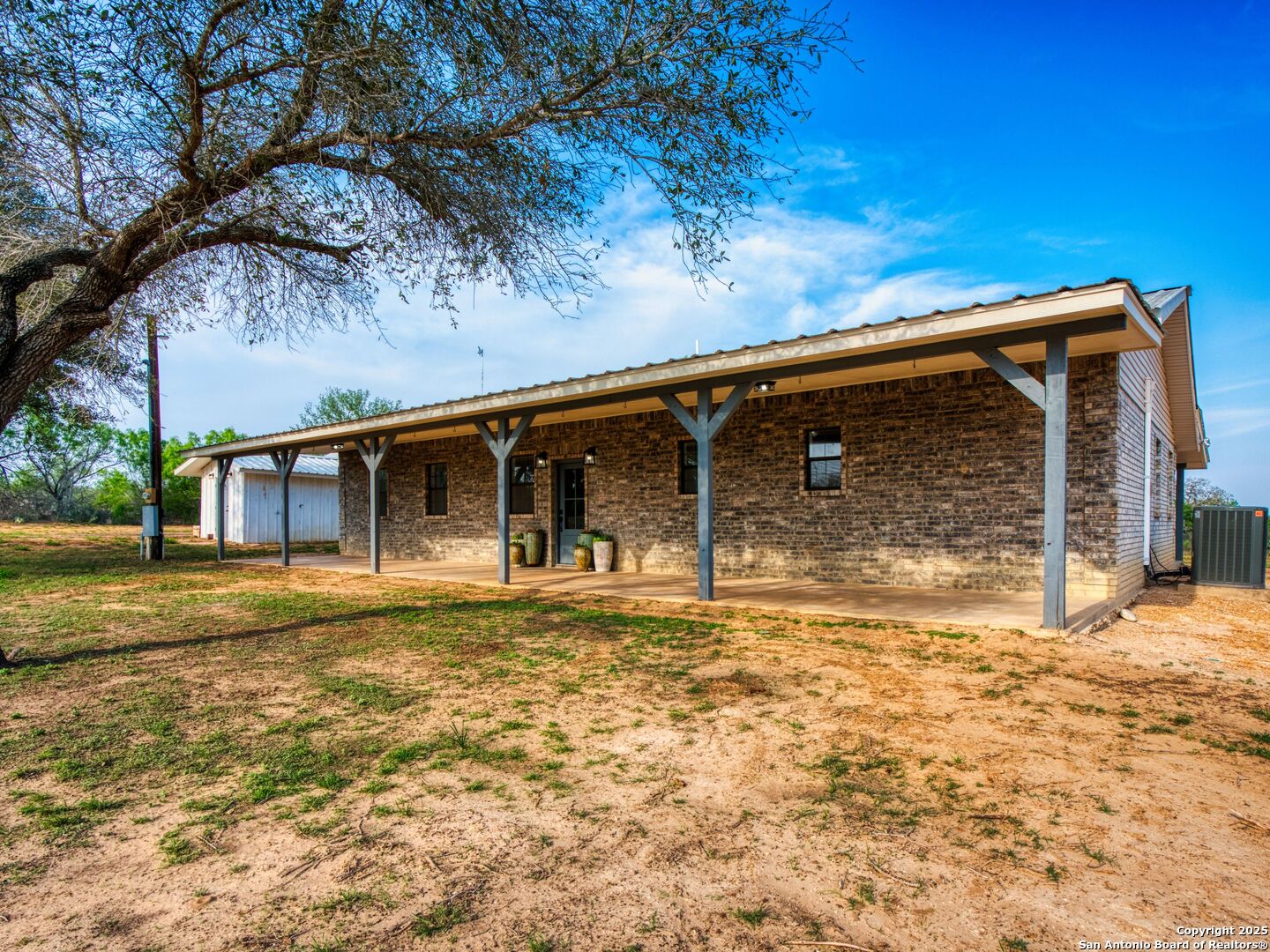 601 Wild Flower Drive Lytle, TX 78052 - Photo 10 of 50 a front view of a house with a garden