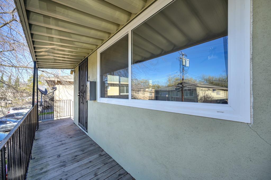 10803 Coloma Road, Unit 4 Rancho Cordova, CA 95670 - Photo 40 of 49 a view of a room with wooden floor and large windows