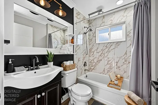 a view of a kitchen with wooden floor and a refrigerator