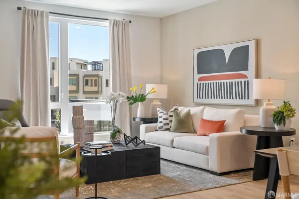 a living room with furniture and a window