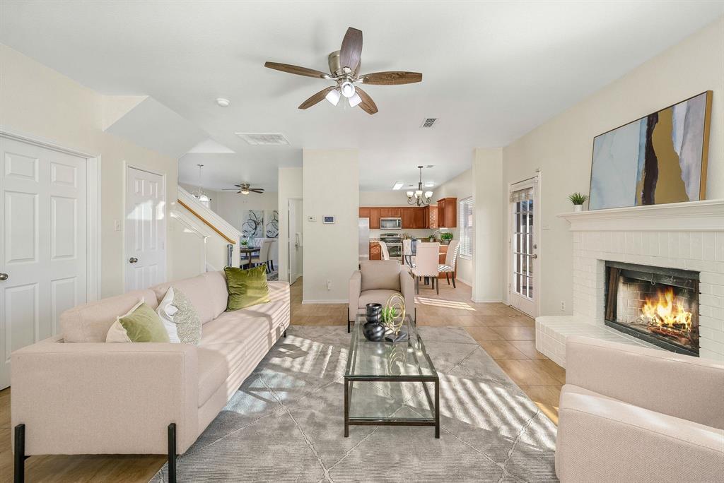 2400 Rushing Springs Drive Fort Worth, TX 76118 - Photo 11 of 40 a living room with furniture and a fireplace