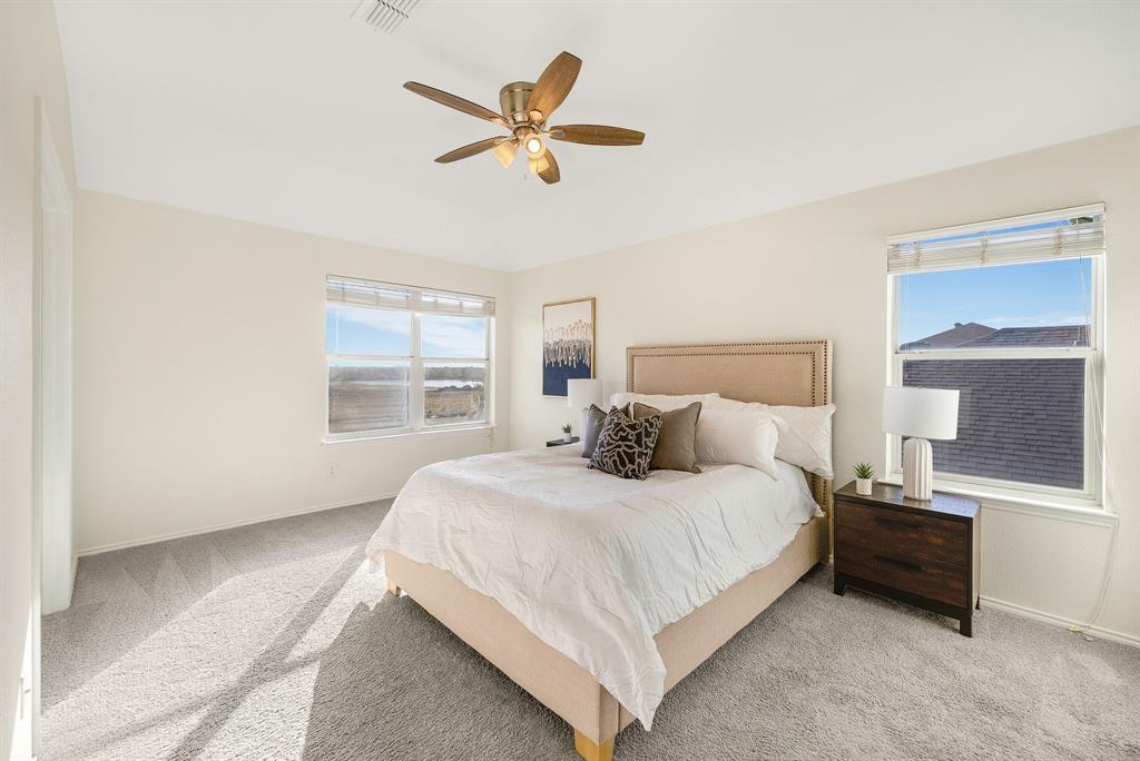 2400 Rushing Springs Drive Fort Worth, TX 76118 - Photo 20 of 40 a bedroom with a bed and window