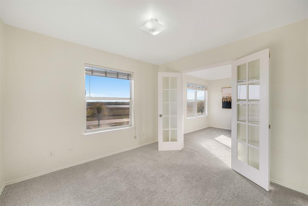 2400 Rushing Springs Drive Fort Worth, TX 76118 - Photo 26 of 40 an empty room with windows and closet