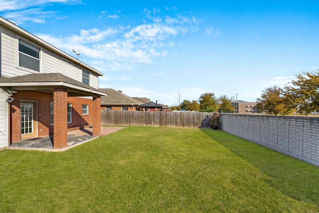 2400 Rushing Springs Drive Fort Worth, TX 76118 - Photo 31 of 40 a house view with swimming pool in front of it