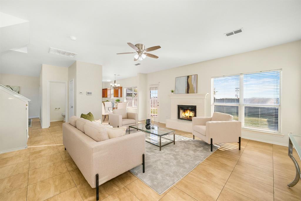2400 Rushing Springs Drive Fort Worth, TX 76118 - Photo 10 of 40 a living room with furniture and a fireplace