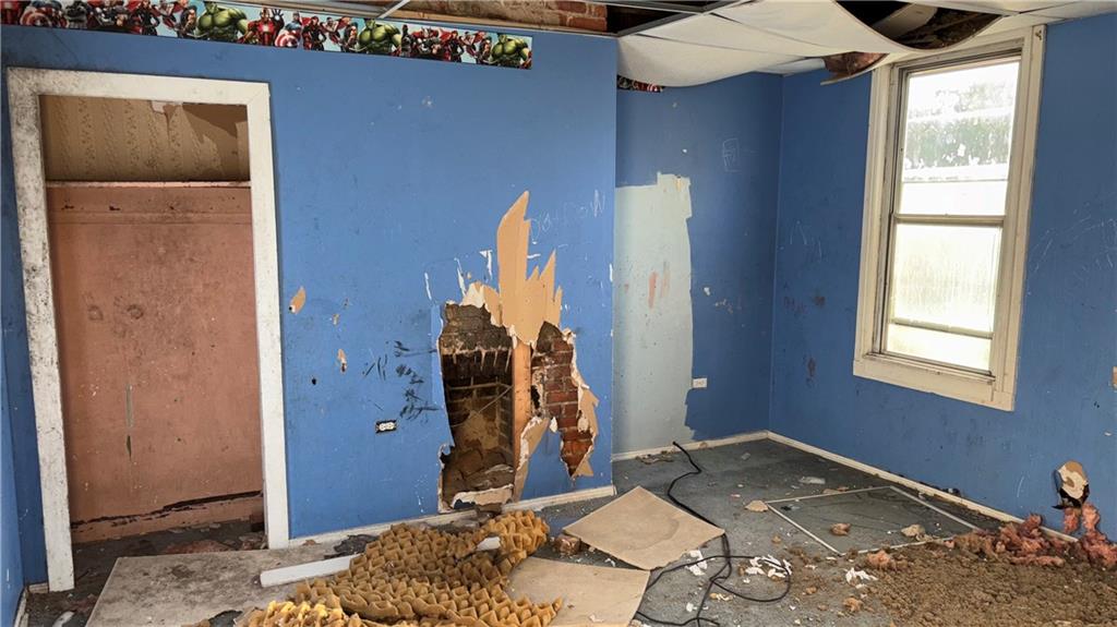 2014 Letsche Street Pittsburgh, PA 15214 - Photo 11 of 12 a bedroom with a bed and a dresser