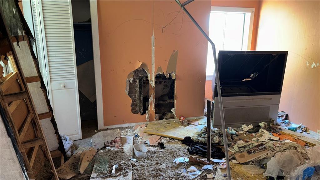 2014 Letsche Street Pittsburgh, PA 15214 - Photo 9 of 12 a bed room with a bed and a mirror