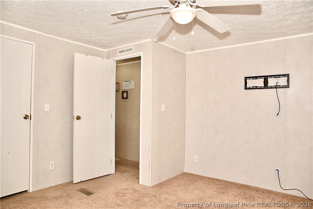 1071 Watts Road Lumberton, NC 28360 - Photo 24 of 31 a view of a hallway with a chandelier fan