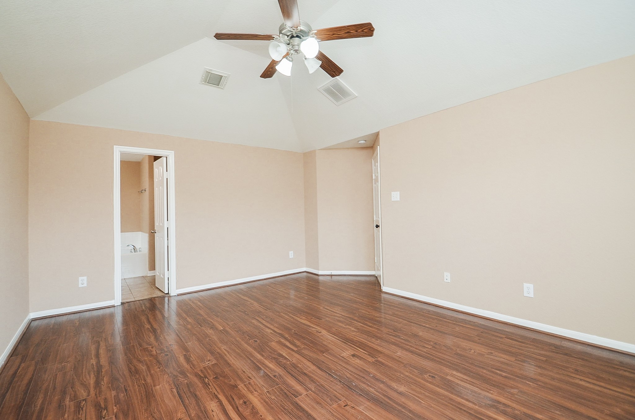 7134 Winston Ranch Parkway Richmond, TX 77406 - Photo 20 of 35 The huge primary suite sits on the first floor; showing in this view, the ensuite bath, up left.