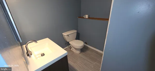 a bathroom with a toilet and a sink