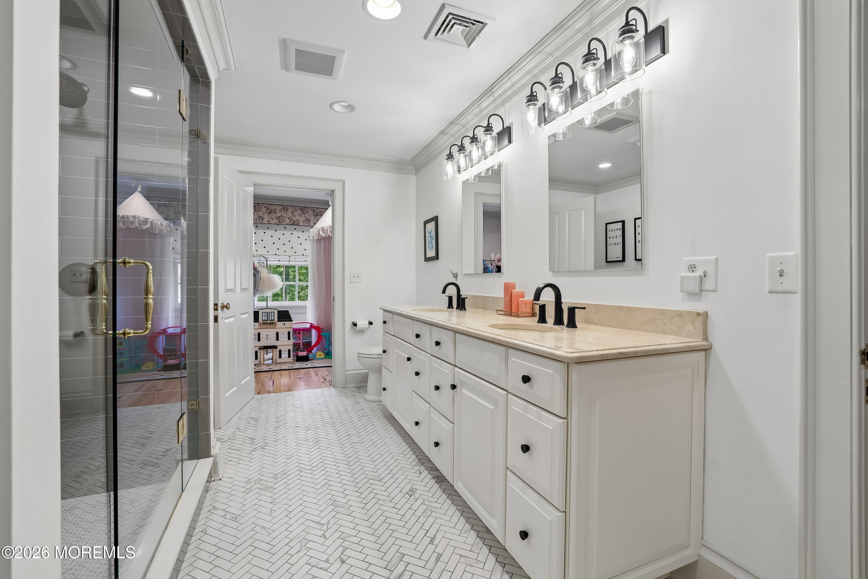 92 Tulip Lane Colts Neck, NJ 07722 - Photo 31 of 55 a en suite bathroom with double sink and a mirror