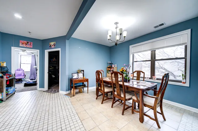 a view of a dining room with furniture window and outside view