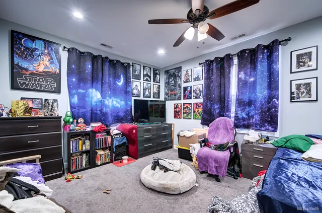 a room with furniture toys and a flat screen tv