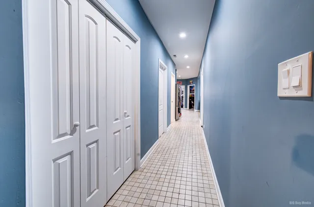 a view of a hallway with a white walls
